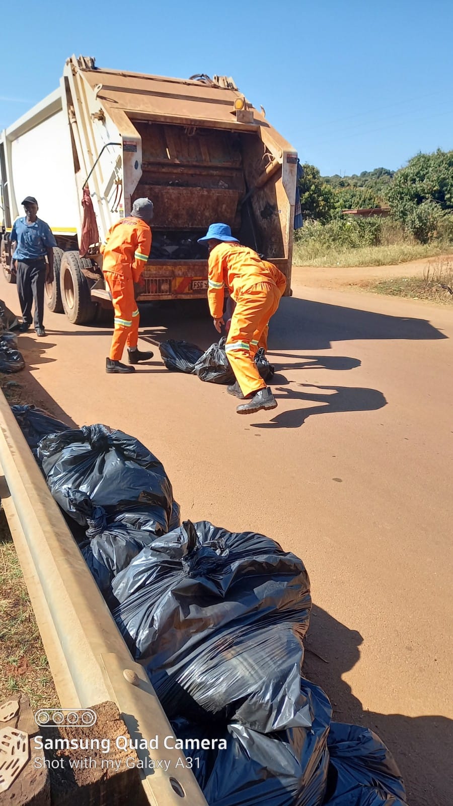 Cleaning dumping area at Dzingahe Village